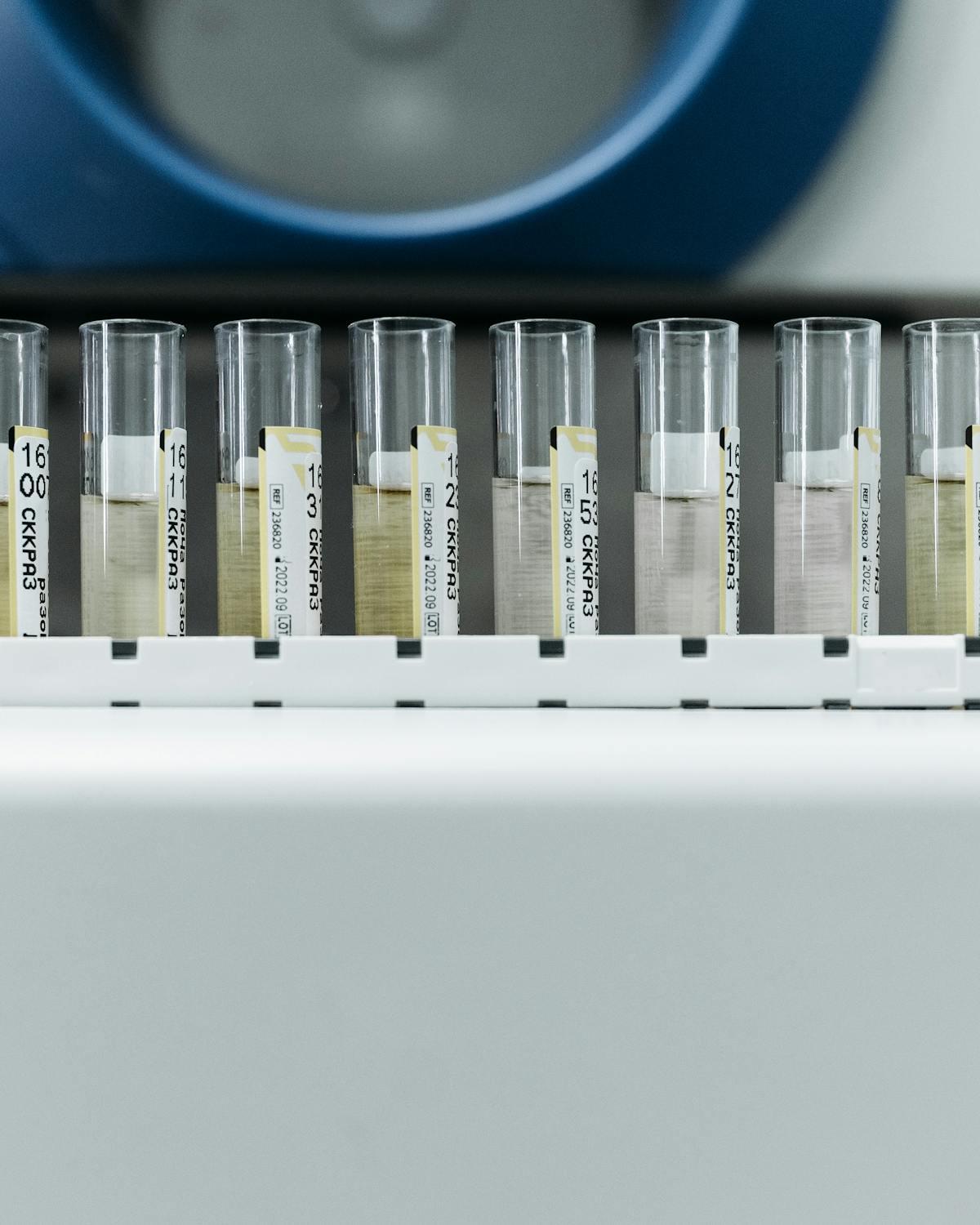 Sample vials lined up on the autosampler tray of an analytical instrument